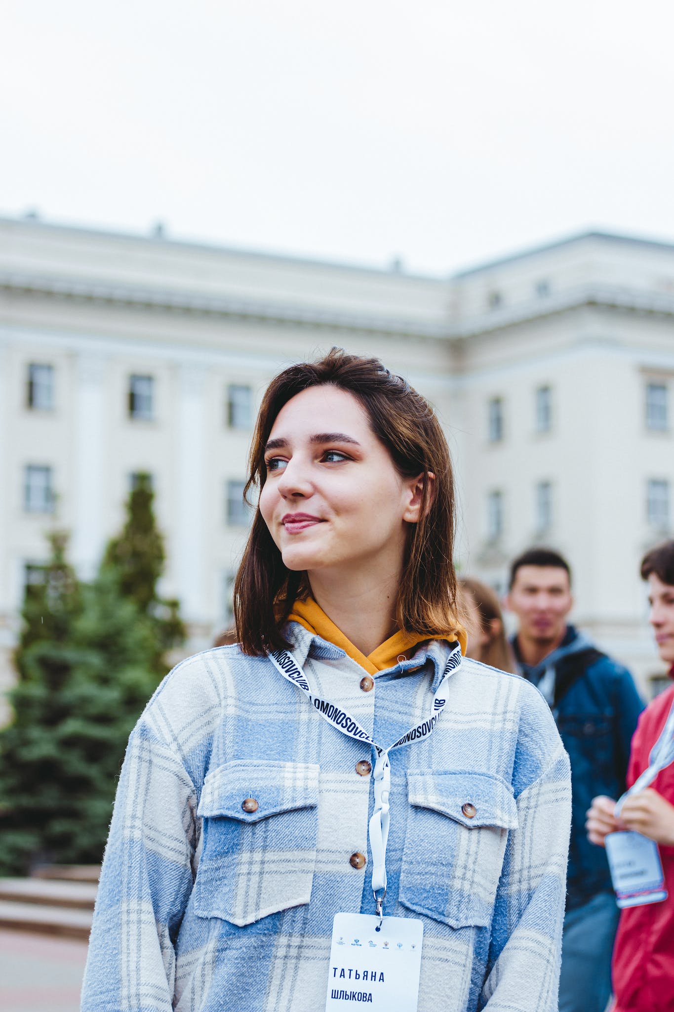 Woman in Blue and White Plaid Long Sleeves Looking Afar